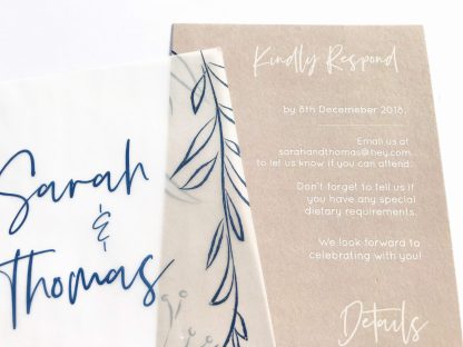 vellum layered wedding invitation navy and blush